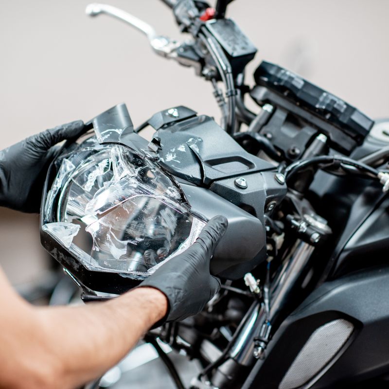 motorcycle closeup of headlight that has been repaired