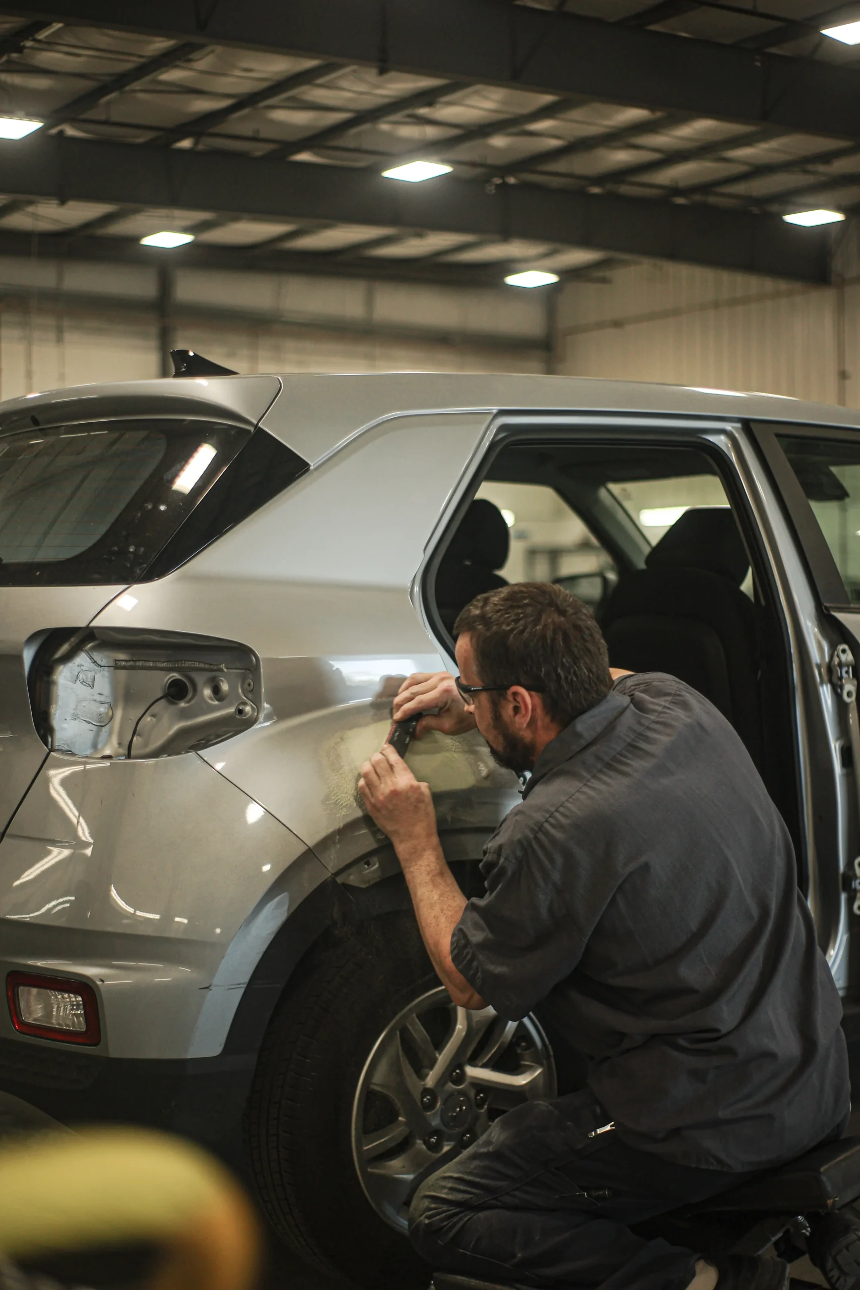 Different angle of filler panel repair on a Hyundai Venue at Tacoma auto body shop